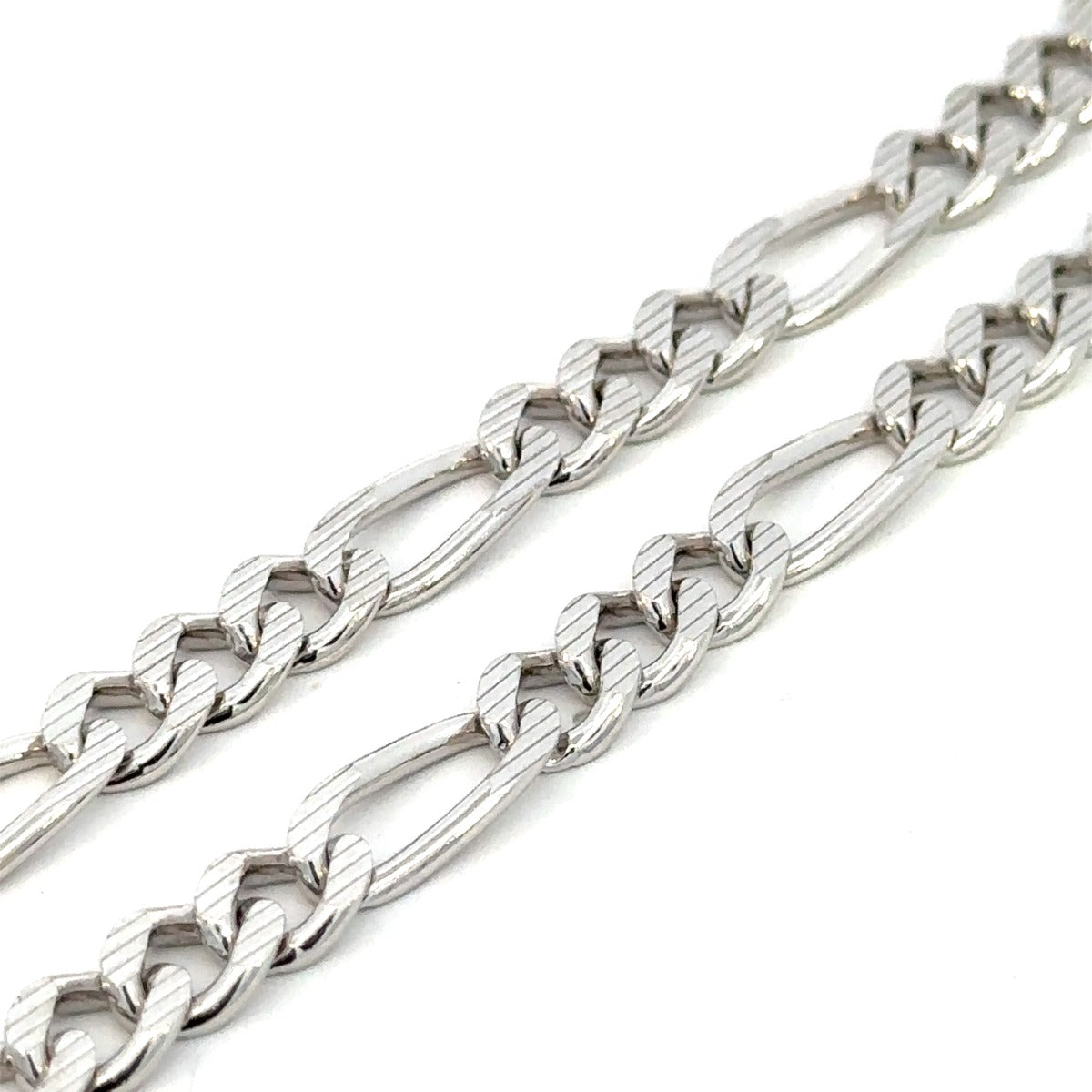 SILVER LAZAR CUT FIGARO CHAIN 7MM